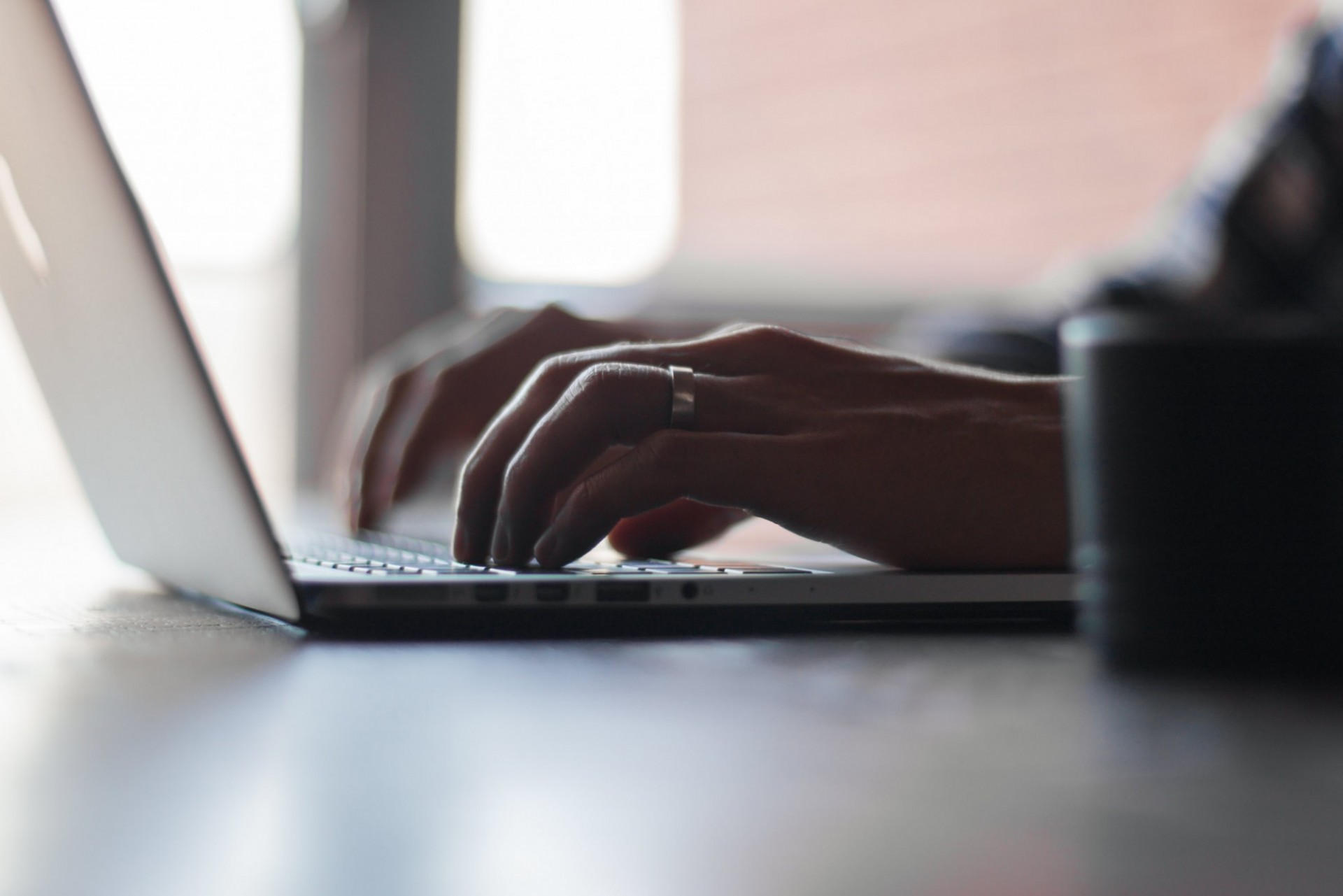 Person typing on laptop