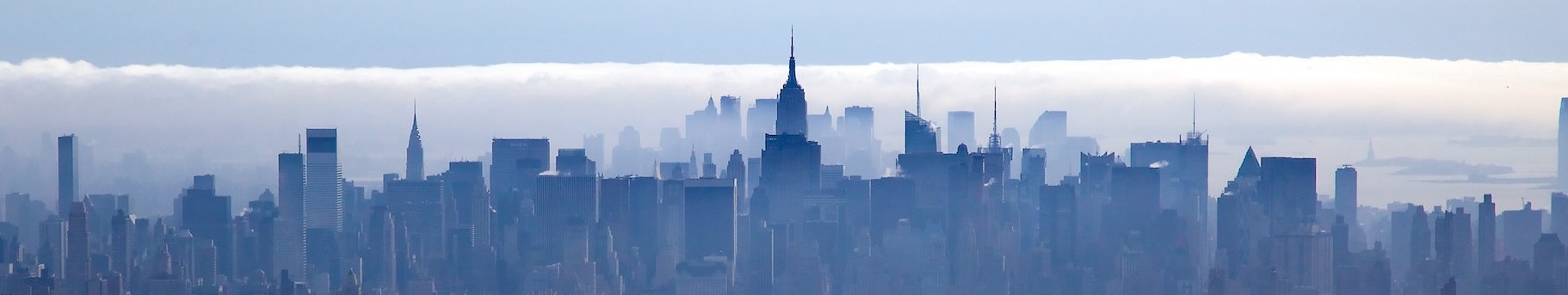 North to south view of Manhattan skyline in shades of blue